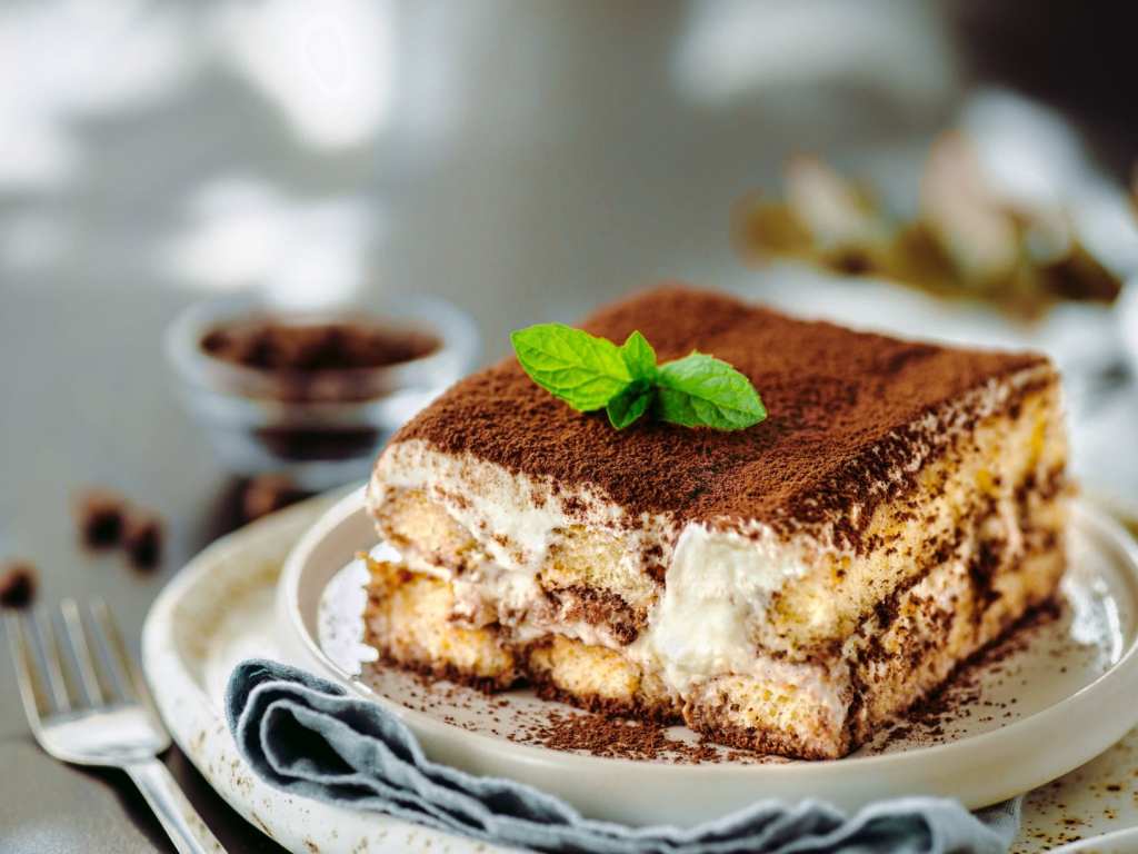 A piece of tiramisu on a plate